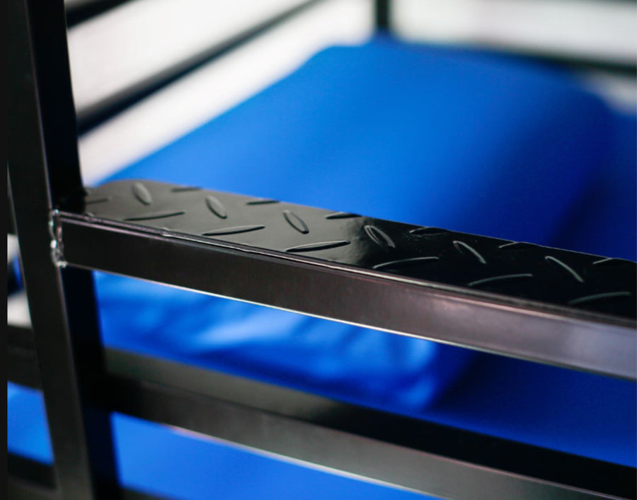 Close-up of a sealed heavy duty steel bed frame with bed-bug-resistant construction